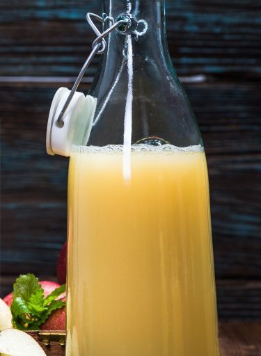 organic apple juice in glass bottle